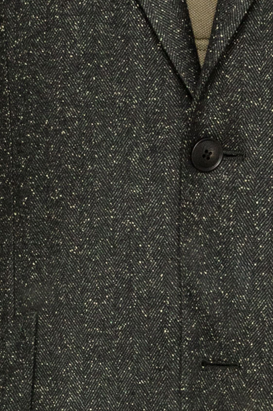 Зеленый пиджак в елочку с белыми вкраплениями